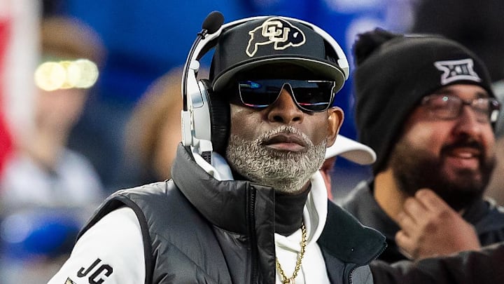 Nov 23, 2024; Kansas City, Missouri, USA; Colorado head coach Deion Sanders watches the run of play during the 3rd quarter between the Kansas Jayhawks and the Colorado Buffaloes at GEHA Field at Arrowhead Stadium. Mandatory Credit: Nick Tre. Smith-Imagn Images Nov 23, 2024; Kansas City, Missouri, USA; Colorado head coach Deion Sanders watches the run of play during the 3rd quarter between the Kansas Jayhawks and the Colorado Buffaloes at GEHA Field at Arrowhead Stadium. Mandatory Credit: Nick Tre. Smith-Imagn Images