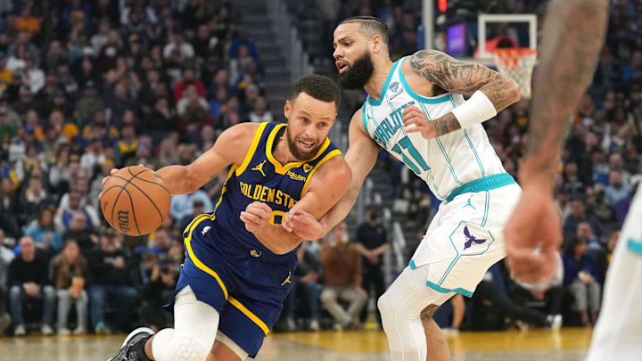 Feb 23, 2024; San Francisco, California, USA; Golden State Warriors guard Stephen Curry (left) dribbles against Charlotte Hornets forward Cody Martin (11) during the first quarter at Chase Center. Mandatory Credit: Darren Yamashita-Imagn Images Feb 23, 2024; San Francisco, California, USA; Golden State Warriors guard Stephen Curry (left) dribbles against Charlotte Hornets forward Cody Martin (11) during the first quarter at Chase Center. Mandatory Credit: Darren Yamashita-Imagn Images