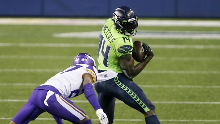 Oct 11, 2020; Seattle, Washington, USA; Seattle Seahawks wide receiver DK Metcalf (14) catches a pass against the Minnesota Vikings during the fourth quarter at CenturyLink Field. Mandatory Credit: Joe Nicholson-Imagn Images