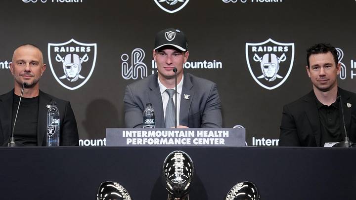 Apr 24, 2026; Henderson, NV, USA; Las Vegas Raiders quarterback Fernando Mendoza (center) speaks at introductory press conference at Intermountain Health Performance Center flanked by general manager John Spytek (left) and head coach Klint Kubiak after being selected as the No. 1 pick in the 2026 NFL Draft. Mandatory Credit: Kirby Lee-Imagn Images Apr 24, 2026; Henderson, NV, USA; Las Vegas Raiders quarterback Fernando Mendoza (center) speaks at introductory press conference at Intermountain Health Performance Center flanked by general manager John Spytek (left) and head coach Klint Kubiak after being selected as the No. 1 pick in the 2026 NFL Draft. Mandatory Credit: Kirby Lee-Imagn Images