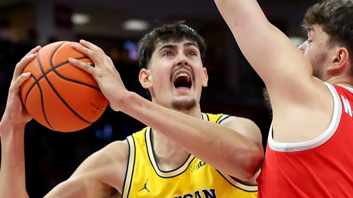 Feb 8, 2026; Columbus, Ohio, USA;  Michigan Wolverines center Aday Mara (15) drives to the basket as Ohio State Buckeyes center Ivan Njegovan (7) defends during the first half at Value City Arena. Mandatory Credit: Joseph Maiorana-Imagn Images