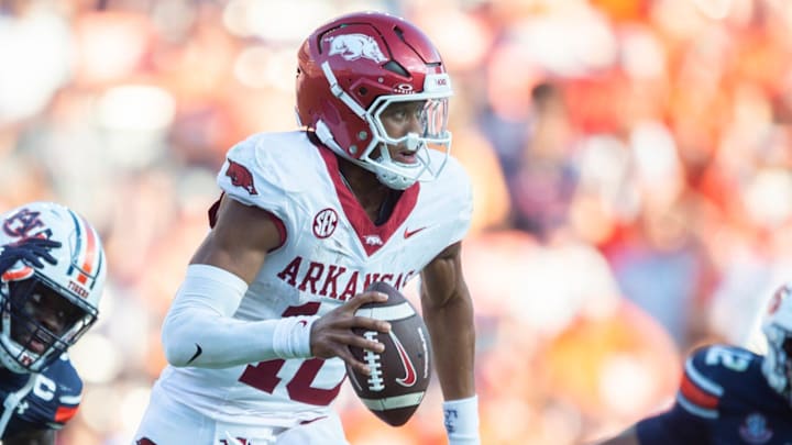 Arkansas Razorbacks quarterback Taylen Green (10) scrambles under pressure from Auburn Tigers linebacker Eugene Asante (9) against Auburn at Jordan-Hare Stadium in Auburn, Ala.