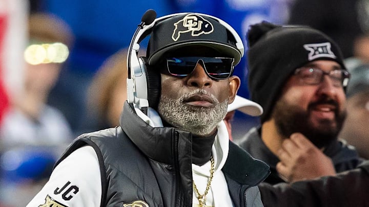 Nov 23, 2024; Kansas City, Missouri, USA;  Colorado head coach Deion Sanders watches the run of play during the 3rd quarter between the Kansas Jayhawks and the Colorado Buffaloes at GEHA Field at Arrowhead Stadium. Mandatory Credit: Nick Tre. Smith-Imagn Images