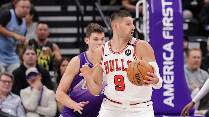 Mar 17, 2025; Salt Lake City, Utah, USA;  Chicago Bulls center Nikola Vucevic (9) tries to spin toward the basket and away from Utah Jazz center Walker Kessler (24) during the first quarter at Delta Center. Mandatory Credit: Chris Nicoll-Imagn Images
