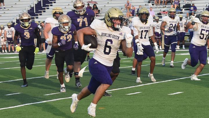 Bowling Green High School running back Jett Reynolds dashes to a touchdown in a scrimmage against Male High School on Friday, August 14, 2026. Bowling Green High School running back Jett Reynolds dashes to a touchdown in a scrimmage against Male High School on Friday, August 14, 2026.
