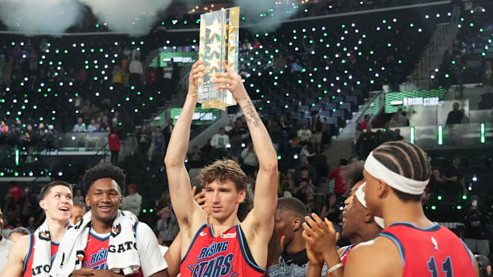 Feb 13, 2026; Inglewood, California, USA; Team Vince frontcourt Matas Buzelis (14) of the Chicago Bulls celebrates with the trophy after defeating Team Melo during an NBA All Star Rising Stars championship game at Intuit Dome. Mandatory Credit: Kirby Lee-Imagn Images Feb 13, 2026; Inglewood, California, USA; Team Vince frontcourt Matas Buzelis (14) of the Chicago Bulls celebrates with the trophy after defeating Team Melo during an NBA All Star Rising Stars championship game at Intuit Dome. Mandatory Credit: Kirby Lee-Imagn Images