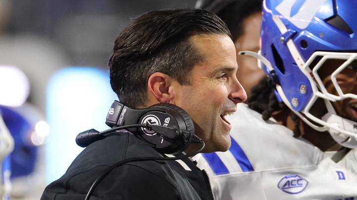 Oct 23, 2026; Charlottesville, Virginia, USA; Duke Blue Devils head coach Manny Diaz (center) celebrates with players after a play against the Virginia Cavaliers during the second half at Scott Stadium. Mandatory Credit: Amber Searls-Imagn Images Oct 23, 2026; Charlottesville, Virginia, USA; Duke Blue Devils head coach Manny Diaz (center) celebrates with players after a play against the Virginia Cavaliers during the second half at Scott Stadium. Mandatory Credit: Amber Searls-Imagn Images