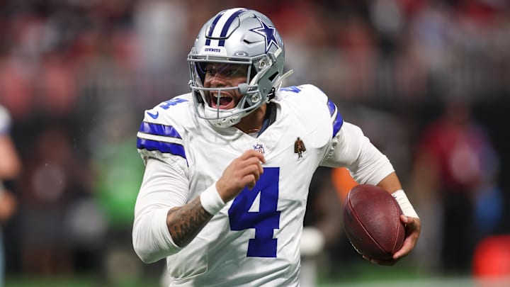 Dallas Cowboys quarterback Dak Prescott runs with the ball. Dallas Cowboys quarterback Dak Prescott runs with the ball.