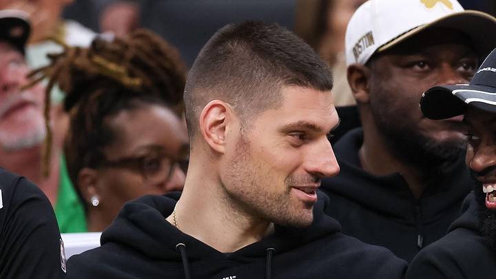 Apr 12, 2026; Boston, Massachusetts, USA; Boston Celtics forward Jaylen Brown (7) and Boston Celtics center Nikola Vucevic (4) talk during the first half against the Orlando Magic at TD Garden. Mandatory Credit: Paul Rutherford-Imagn Images