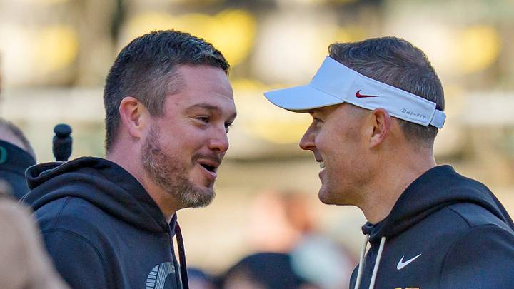 Oregon head coach Dan Lanning, left, and USC head coach Lincoln Riley shake hands before the game as the Oregon Ducks host the USC Trojans on Nov. 22, 2025, at Autzen Stadium in Eugene, Oregon. Oregon head coach Dan Lanning, left, and USC head coach Lincoln Riley shake hands before the game as the Oregon Ducks host the USC Trojans on Nov. 22, 2025, at Autzen Stadium in Eugene, Oregon.