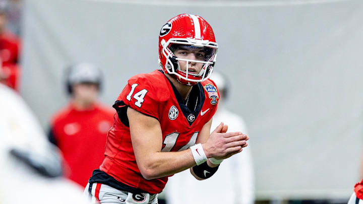 Jan 2, 2025; New Orleans, LA, USA;  Georgia Bulldogs quarterback Gunner Stockton (14) looks on against the Notre Dame Fighting Irish during the second half at Caesars Superdome. Mandatory Credit: Stephen Lew-Imagn Images