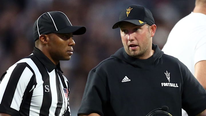 Sep 6, 2025; Starkville, Mississippi, USA; Arizona State Sun Devils head coach Kenny Dillingham talks with an official during the first quarter against the Mississippi State Bulldogs at Davis Wade Stadium at Scott Field. Mandatory Credit: Petre Thomas-Imagn Images