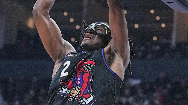 Apr 9, 2025; Toronto, Ontario, CAN; Toronto Raptors forward Jonathan Mogbo (2) dunks against the Charlotte Hornets during the second quarter at Scotiabank Arena. Mandatory Credit: Nick Turchiaro-Imagn Images