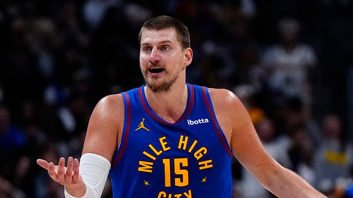 May 9, 2025; Denver, Colorado, USA; Denver Nuggets center Nikola Jokic (15) reacts to a foul called in the first half against the Oklahoma City Thunder during game three of the second round for the 2025 NBA Playoffs at Ball Arena. Mandatory Credit: Ron Chenoy-Imagn Images