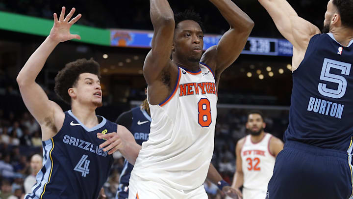 Apr 1, 2026; Memphis, Tennessee, USA; New York Knicks forward OG Anunoby (8) handles the ball as Memphis Grizzlies guard Walter Clayton Jr. (4) and forward Tyler Burton (5) defend during the second quarter at FedExForum. Mandatory Credit: Petre Thomas-Imagn Images