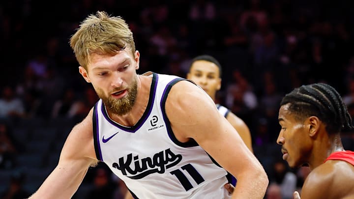 Oct 8, 2025; Sacramento, California, USA; Sacramento Kings forward/center Domantas Sabonis (11) dribbles the ball against Toronto Raptors guard Ochai Agbaji (30) during the first quarter at Golden 1 Center. Mandatory Credit: Sergio Estrada-Imagn Images Oct 8, 2025; Sacramento, California, USA; Sacramento Kings forward/center Domantas Sabonis (11) dribbles the ball against Toronto Raptors guard Ochai Agbaji (30) during the first quarter at Golden 1 Center. Mandatory Credit: Sergio Estrada-Imagn Images