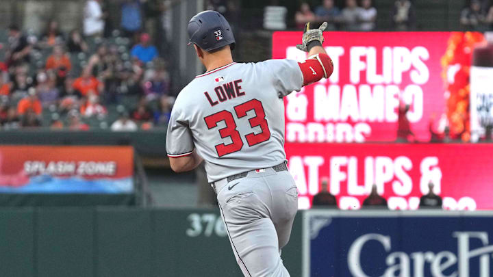 May 16, 2025; Baltimore, Maryland, USA; Washington Nationals first baseman Nathaniel Lowe (33) rounds the bases following his solo home run in the second inning against the Baltimore Orioles at Oriole Park at Camden Yards. 