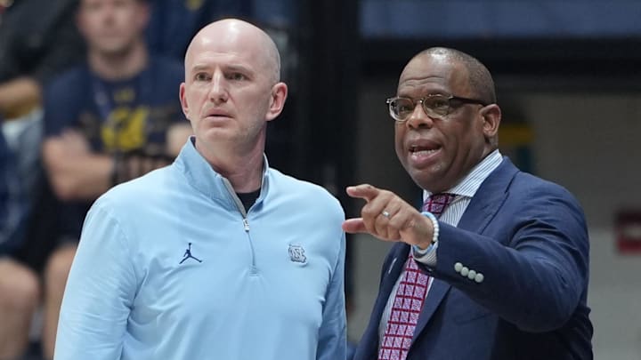 Jan 17, 2026; Berkeley, California, USA; North Carolina Tar Heels assistant coach Brad Frederick (left) and head coach Hubert Davis (right) talk during the first half against the California Golden Bears at Haas Pavilion. Mandatory Credit: Darren Yamashita-Imagn Images Jan 17, 2026; Berkeley, California, USA; North Carolina Tar Heels assistant coach Brad Frederick (left) and head coach Hubert Davis (right) talk during the first half against the California Golden Bears at Haas Pavilion. Mandatory Credit: Darren Yamashita-Imagn Images
