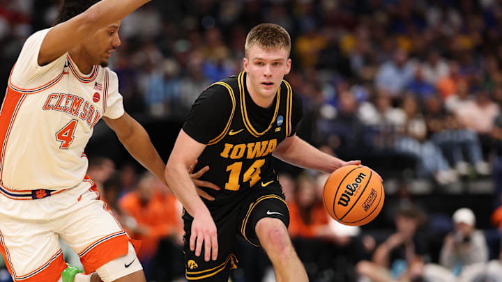 Mar 20, 2026; Tampa, FL, USA; Iowa Hawkeyes guard Bennett Stirtz (14) drives the ball while defended by Clemson Tigers guard Butta Johnson (4) in the second half during a first round game of the men's 2026 NCAA Tournament at Benchmark International Arena. Mandatory Credit: Matt Pendleton-Imagn Images Mar 20, 2026; Tampa, FL, USA; Iowa Hawkeyes guard Bennett Stirtz (14) drives the ball while defended by Clemson Tigers guard Butta Johnson (4) in the second half during a first round game of the men's 2026 NCAA Tournament at Benchmark International Arena. Mandatory Credit: Matt Pendleton-Imagn Images