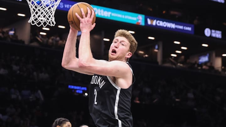 Mar 10, 2026; Brooklyn, New York, USA;  Brooklyn Nets forward Danny Wolf (2) grabs a rebound in the fourth quarter against the Detroit Pistons at Barclays Center. Mandatory Credit: Wendell Cruz-Imagn Images