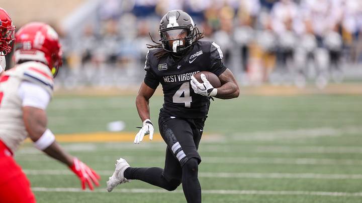 Oct 10, 2026; Morgantown, West Virginia, USA; West Virginia Mountaineers running back Cam Cook (4) runs the ball during the third quarter against the Arizona Wildcats at Milan Puskar Stadium. Mandatory Credit: Ben Queen-Imagn Images Oct 10, 2026; Morgantown, West Virginia, USA; West Virginia Mountaineers running back Cam Cook (4) runs the ball during the third quarter against the Arizona Wildcats at Milan Puskar Stadium. Mandatory Credit: Ben Queen-Imagn Images