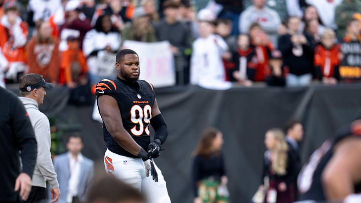 Cincinnati Bengals defensive end Myles Murphy (99) stretches with the team before the NFL game between the Cincinnati Bengals and the Denver Broncos at Paycor Stadium in Cincinnati on Saturday, Dec. 28, 2024.