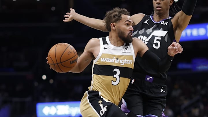 Mar 5, 2026; Washington, District of Columbia, USA; Washington Wizards guard Trae Young (3) drives to the basket as Utah Jazz forward Cody Williams (5) defends in the first half at Capital One Arena. Mandatory Credit: Geoff Burke-Imagn Images