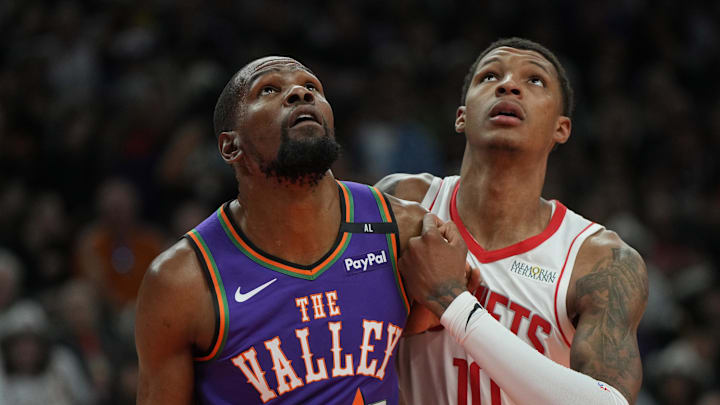 Mar 30, 2025; Phoenix, Arizona, USA; Phoenix Suns forward Kevin Durant (35) and Houston Rockets forward Jabari Smith Jr. (10) fight for position in the first half at Footprint Center. Mandatory Credit: Rick Scuteri-Imagn Images