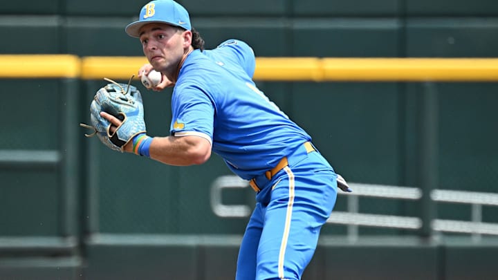 Jun 14, 2025; Omaha, Neb, USA;  UCLA Bruins shortstop Roch Cholowsky (1) completes a double play against the Murray State Racers during the second inning at Charles Schwab Field. Mandatory Credit: Steven Branscombe-Imagn Images
