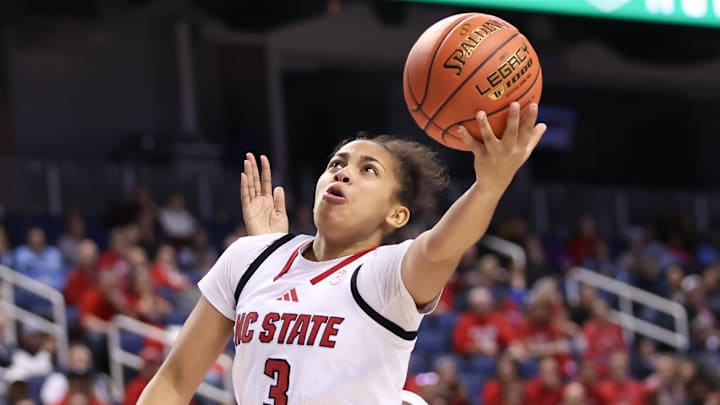 Mar 7, 2025; Greensboro, NC, USA;  NC State Wolfpack guard Zamareya Jones (3) goes to the basket during the third quarter against Georgia Tech Yellow Jackets at First Horizon Coliseum. Mandatory Credit: Cory Knowlton-Imagn Images