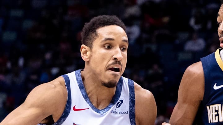 Jan 3, 2025; New Orleans, Louisiana, USA;  Washington Wizards guard Malcolm Brogdon (15) dribbles against New Orleans Pelicans guard Trey Murphy III (25) during the first half at Smoothie King Center. Mandatory Credit: Stephen Lew-Imagn Images