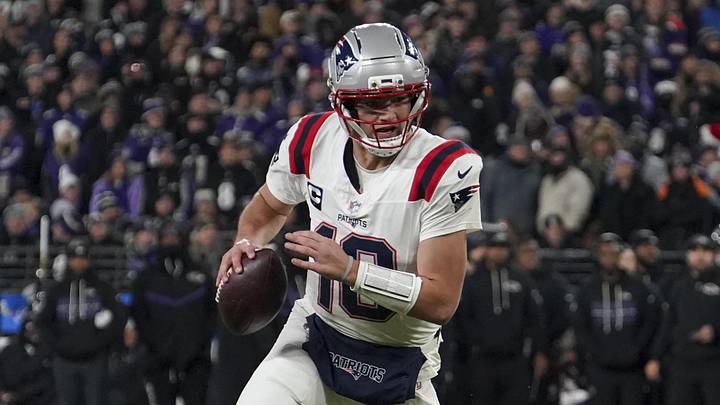 Dec 21, 2025; Baltimore, Maryland, USA;  New England Patriots halfback Drake Maye (10) runs the ball against the Baltimore Ravens during the first half of the game at M&T Bank Stadium. Mandatory Credit: James Lang-Imagn Images