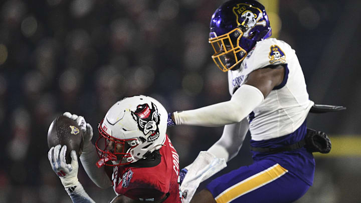 Dec 28, 2024; Annapolis, MD, USA;  North Carolina State Wolfpack cornerback Tamarcus Cooley (15) intercepts a pass during the second half of the  Go Bowling Military Bowl against the East Carolina Pirates at Navy-Marine Corps Memorial Stadium. Mandatory Credit: Tommy Gilligan-Imagn Images