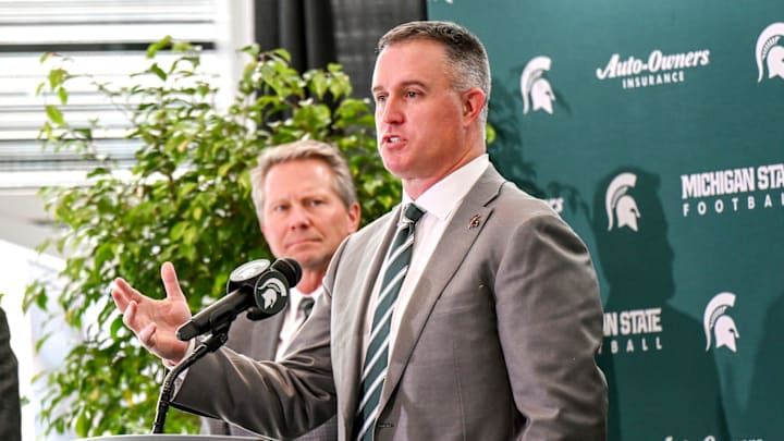 Michigan State's new football coach Pat Fitzgerald, right,, talks during his introductory press conference on Tuesday, Dec. 2, 2025, at the Tom Izzo Football Building in East Lansing.
