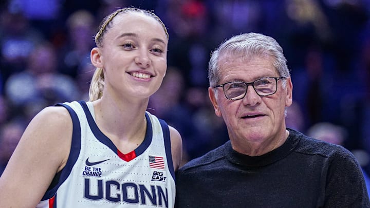 Jan 22, 2025; Storrs, Connecticut, USA; UConn Huskies guard Paige Bueckers (5) is recognized with head coach Geno Auriemma for her 2000 career points before the start of the game against the Villanova Wildcats at Harry A. Gampel Pavilion. Mandatory Credit: David Butler II-Imagn Images Jan 22, 2025; Storrs, Connecticut, USA; UConn Huskies guard Paige Bueckers (5) is recognized with head coach Geno Auriemma for her 2000 career points before the start of the game against the Villanova Wildcats at Harry A. Gampel Pavilion. Mandatory Credit: David Butler II-Imagn Images