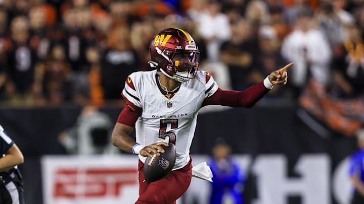 Sep 23, 2024; Cincinnati, Ohio, USA; Washington Commanders quarterback Jayden Daniels (5) runs with the ball against the Cincinnati Bengals in the first half at Paycor Stadium. Mandatory Credit: Katie Stratman-Imagn Images Sep 23, 2024; Cincinnati, Ohio, USA; Washington Commanders quarterback Jayden Daniels (5) runs with the ball against the Cincinnati Bengals in the first half at Paycor Stadium. Mandatory Credit: Katie Stratman-Imagn Images