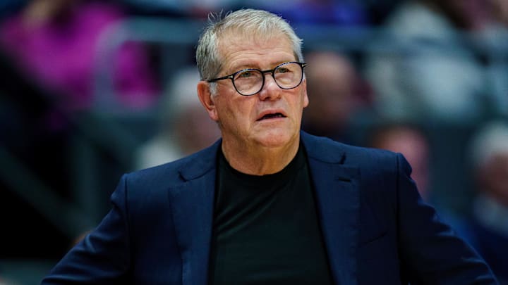 Nov 16, 2025; Hartford, Connecticut, USA; UConn Huskies head coach Geno Auriemma watches from the sideline as they take on the Ohio State Buckeyes at Peoples Bank Arena. Mandatory Credit: David Butler II-Imagn Images Nov 16, 2025; Hartford, Connecticut, USA; UConn Huskies head coach Geno Auriemma watches from the sideline as they take on the Ohio State Buckeyes at Peoples Bank Arena. Mandatory Credit: David Butler II-Imagn Images