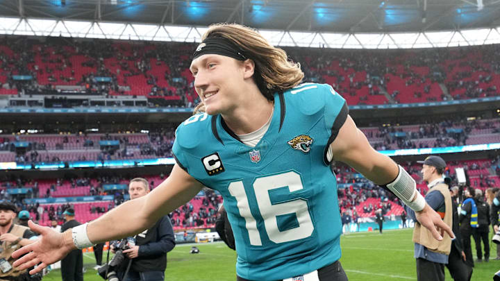 Oct 20, 2024; London, United Kingdom; Jacksonville Jaguars quarterback Trevor Lawrence (16) celebrates after the game against the New England Patriots in an NFL International Series game at Wembley Stadium. Mandatory Credit: Kirby Lee-Imagn Images
