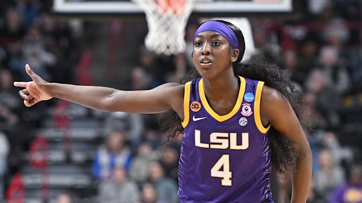 Mar 30, 2025; Spokane, WA, USA; LSU Lady Tigers guard Flau'Jae Johnson (4) reacts after play against the UCLA Bruins during the first half of a Elite 8 NCAA Tournament basketball game at Spokane Arena. Mandatory Credit: James Snook-Imagn Images