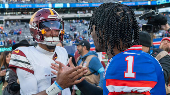 Washington Commanders quarterback Jayden Daniels (5) shakes hands with New York Giants wide receiver Malik Nabers (1) . Washington Commanders quarterback Jayden Daniels (5) shakes hands with New York Giants wide receiver Malik Nabers (1) .