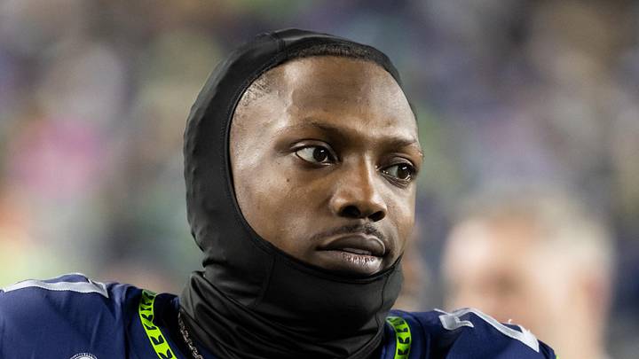 Former Seattle Seahawks cornerback Riq Woolen stands on the sidelines