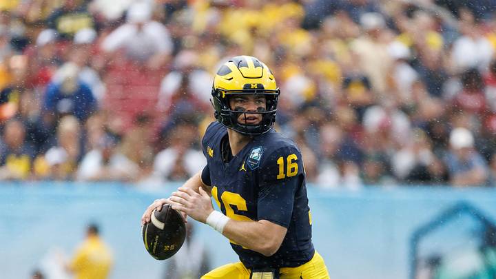 Dec 31, 2024; Tampa, FL, USA; Michigan Wolverines quarterback Davis Warren (16) looks to throw against the Alabama Crimson Tide during the first half at Raymond James Stadium. Mandatory Credit: Matt Pendleton-Imagn Images