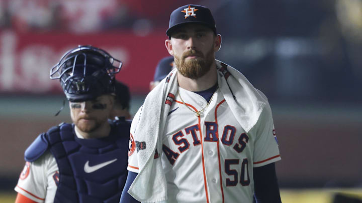 Houston Astros starting pitcher Mike Burrows (50) walks to the dugout before the game.