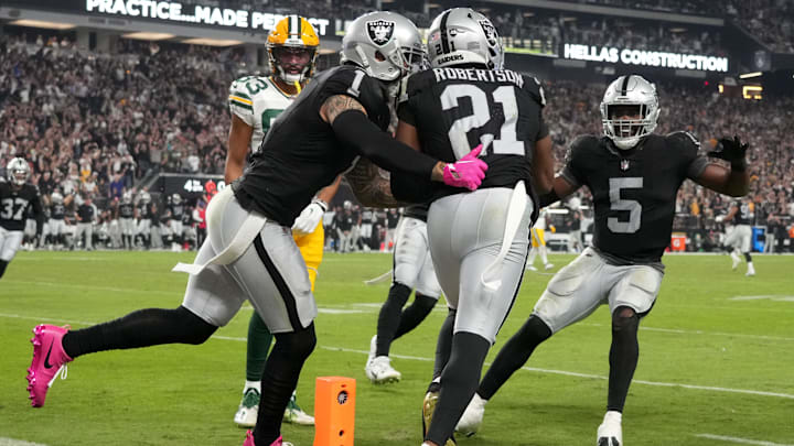 Oct 9, 2023; Paradise, Nevada, USA; Las Vegas Raiders cornerback Amik Robertson (21) celebrates with linebacker Divine Deablo (5) and safety Marcus Epps (1) after intercepting a pass in the fourth quarter against the Las Vegas Raiders at Allegiant Stadium. Mandatory Credit: Kirby Lee-Imagn Images Oct 9, 2023; Paradise, Nevada, USA; Las Vegas Raiders cornerback Amik Robertson (21) celebrates with linebacker Divine Deablo (5) and safety Marcus Epps (1) after intercepting a pass in the fourth quarter against the Las Vegas Raiders at Allegiant Stadium. Mandatory Credit: Kirby Lee-Imagn Images
