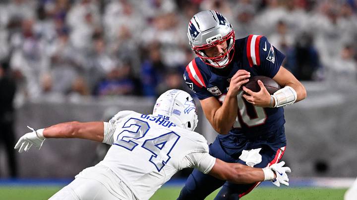 Oct 5, 2025; Orchard Park, New York, USA; New England Patriots quarterback Drake Maye (10) rushes the ball against Buffalo Bills safety Cole Bishop (24) during the second half at Highmark Stadium. Mandatory Credit: Mark Konezny-Imagn Images
