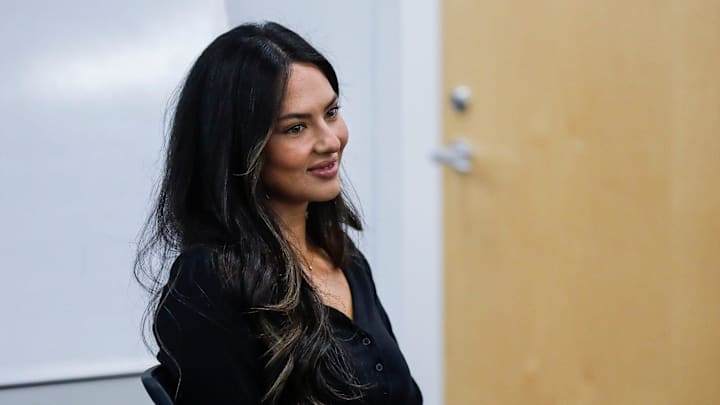 Detroit Lions quarterback Jared Goff's wife Christen Goff listens as Goff speaks at Detroit Lions headquarters 