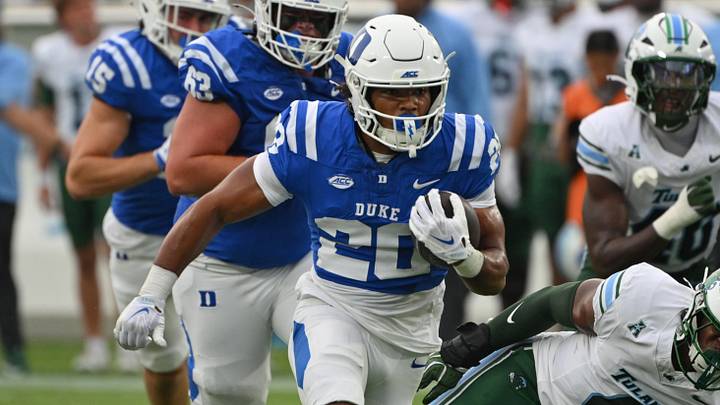 Sep 5, 2026; Durham, North Carolina, USA; Duke Blue Devils running back Nate Sheppard (20) runs the ball past Tulane Green Wave linebacker Chris Rodgers (4) during the first quarter at Wallace Wade Stadium. Mandatory Credit: Zachary Taft-Imagn Images Sep 5, 2026; Durham, North Carolina, USA; Duke Blue Devils running back Nate Sheppard (20) runs the ball past Tulane Green Wave linebacker Chris Rodgers (4) during the first quarter at Wallace Wade Stadium. Mandatory Credit: Zachary Taft-Imagn Images