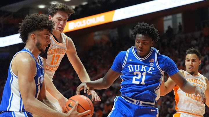 Duke forward Cameron Boozer (12) gets the ball on the rebound before Tennessee forward J.P. Estrella (13), Duke center Patrick Ngongba II (21), Tennessee guard Ethan Burg (35) and Tennessee forward Cade Phillips (12) during a college basketball exhibition game on October 26, 2025, in Knoxville, Tenn.