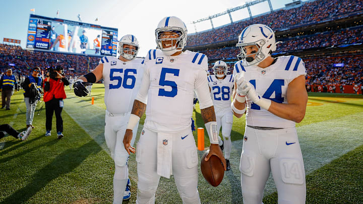 Dec 15, 2024; Denver, Colorado, USA; Indianapolis Colts quarterback Anthony Richardson (5) celebrates with guard Quenton Nelson (56) and wide receiver Alec Pierce (14) after a touchdown in the first quarter against the Denver Broncos at Empower Field at Mile High. Mandatory Credit: Isaiah J. Downing-Imagn Images