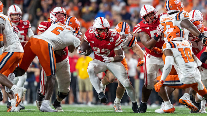 Nebraska running back Dante Dowdell rushes for a 7-yard gain against Illinois.